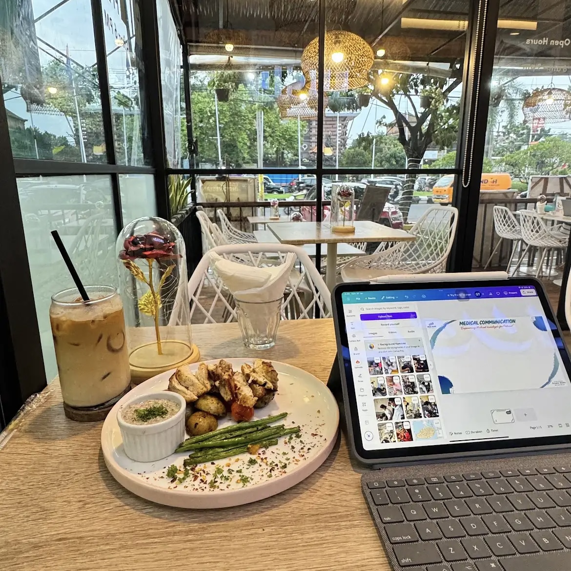 Freelancer's Afternoon Work at Lucid Cafe Bali. Accompanied by Lucid's Signature Iced Coffee with Milk and Chicken Tender Steak.